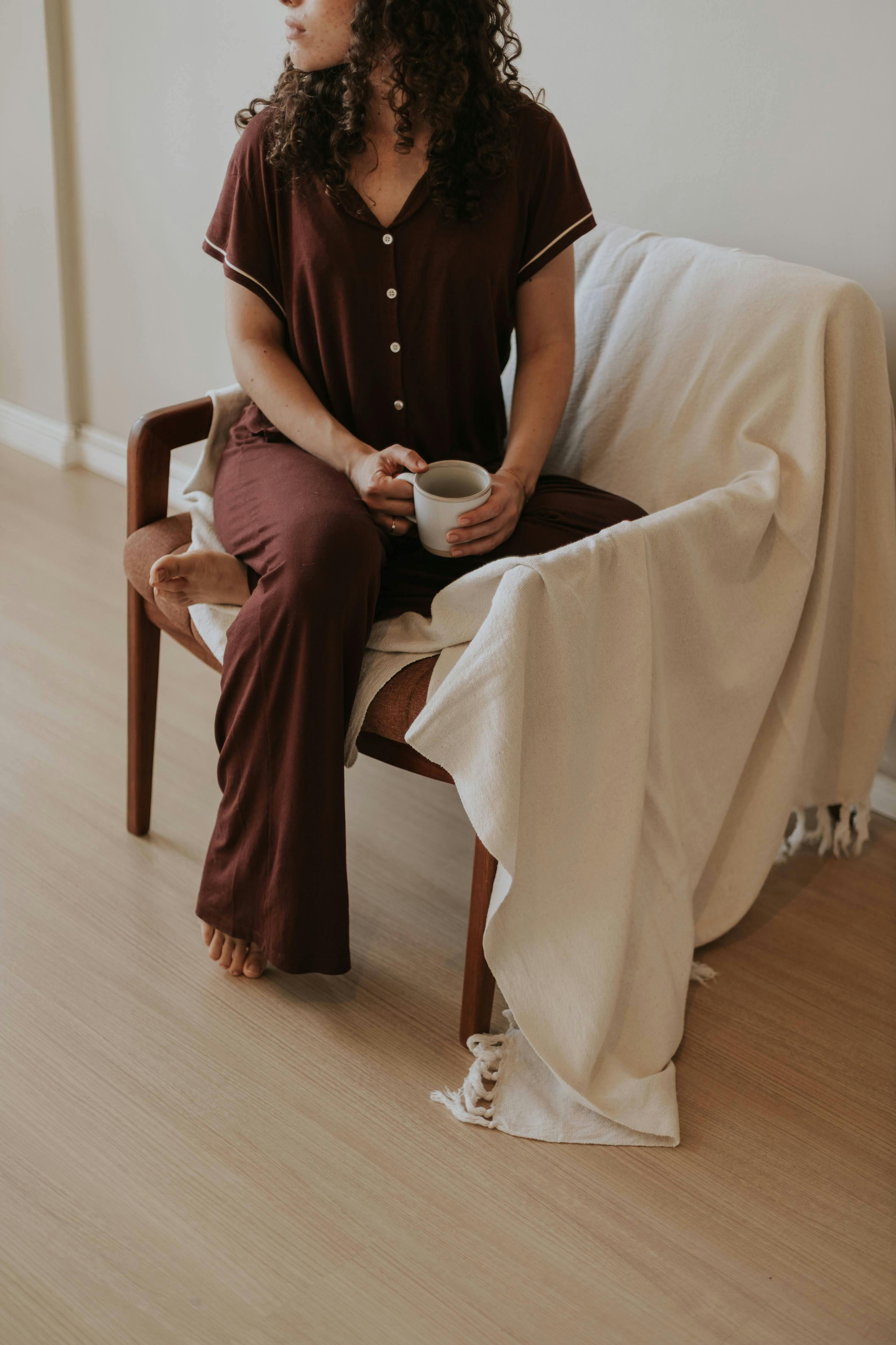 mom relaxing with tea and chocolate as part of a simple night routine